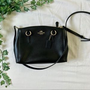 Black and gold medium bulky coach purse